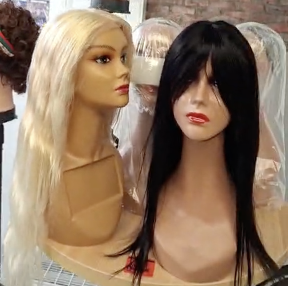 Wig display at Tres Joli Afro Salon